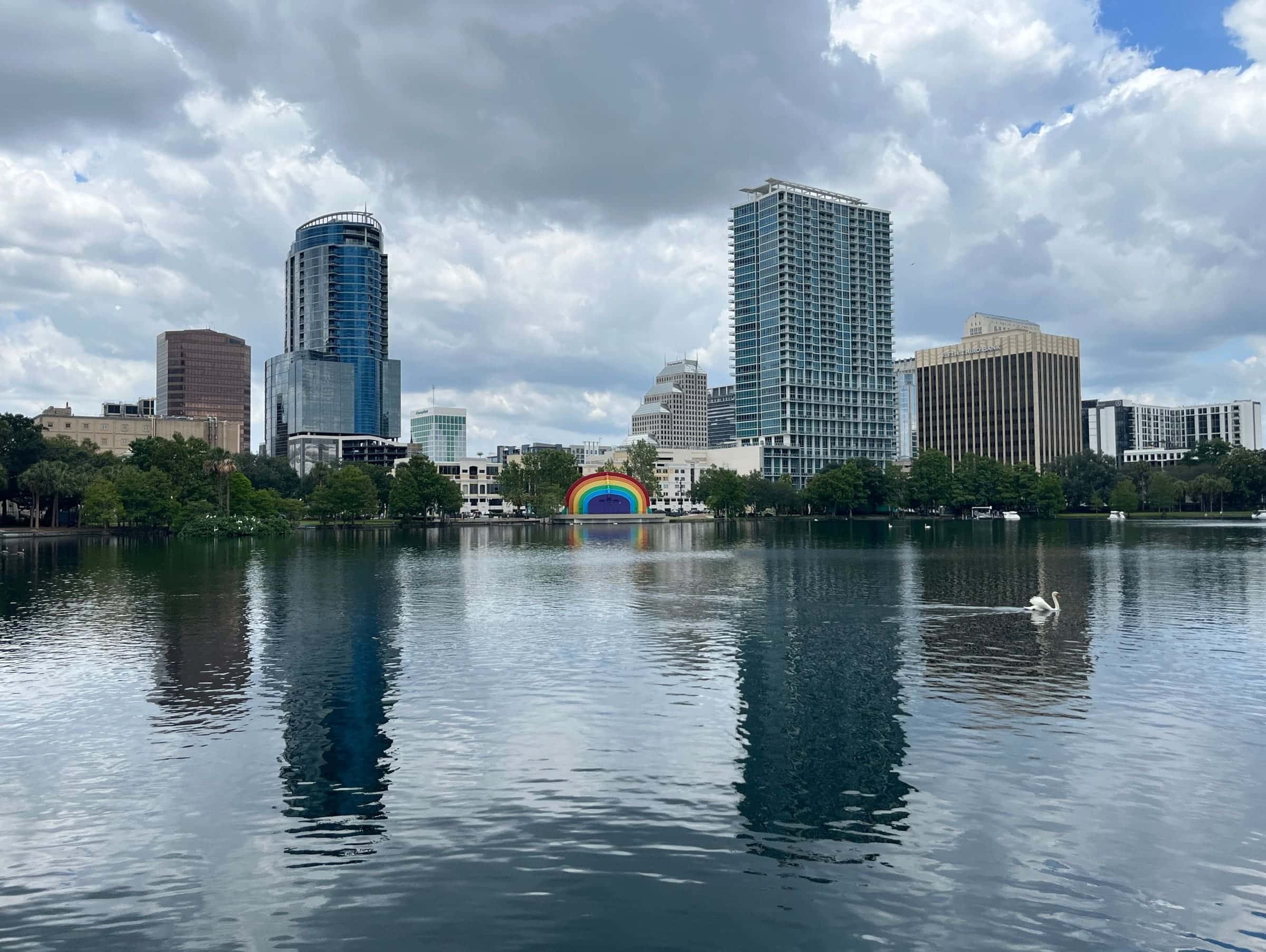 Lake Eola Park and the Downtown Orlando skyline under summer clouds